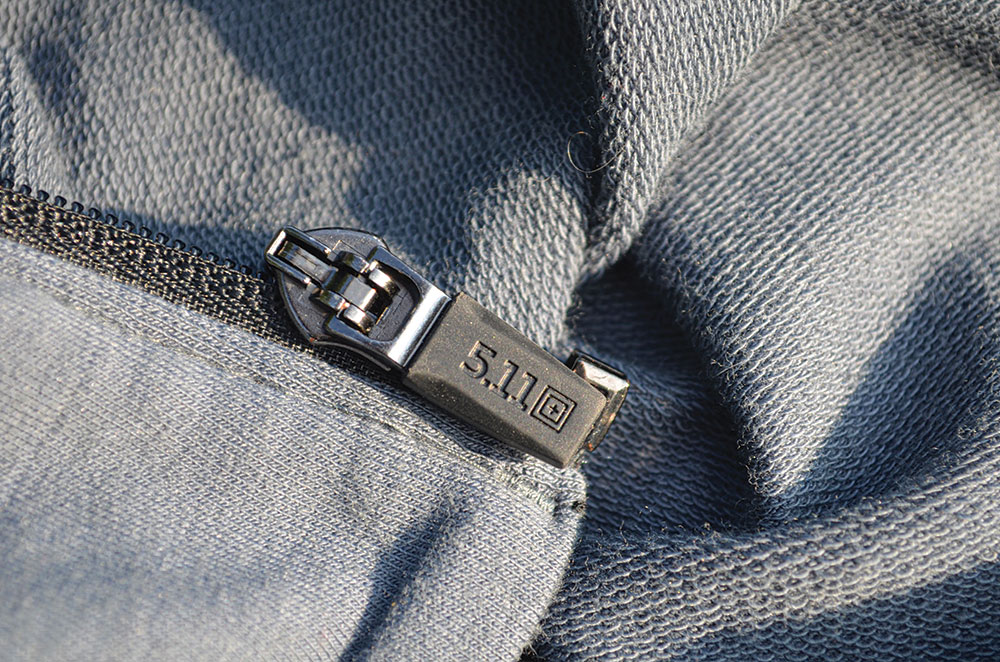 A rubberized pull tab on the zipper