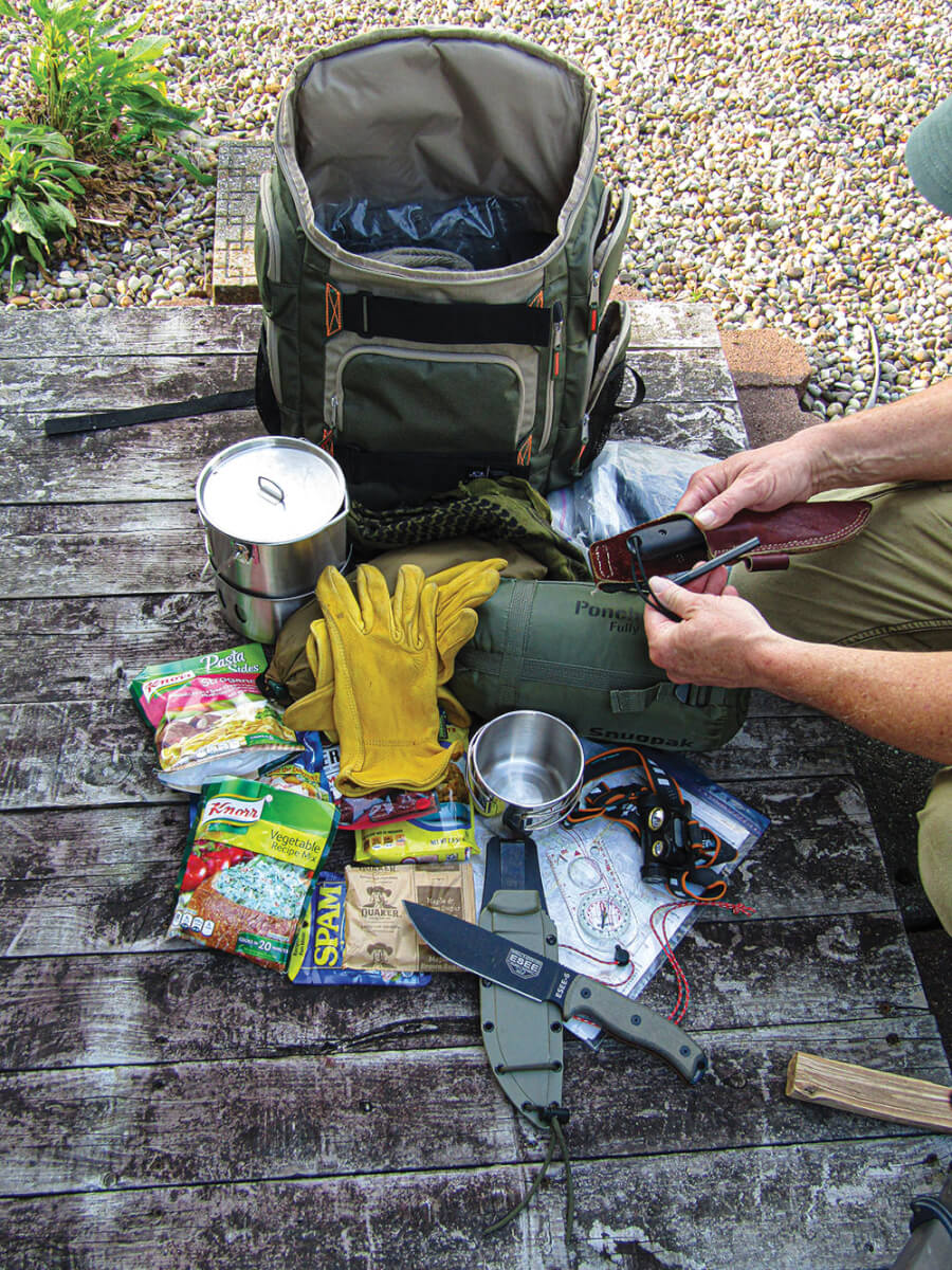 Before heading into the wilderness, the author always takes time to inventory and inspect his gear.
