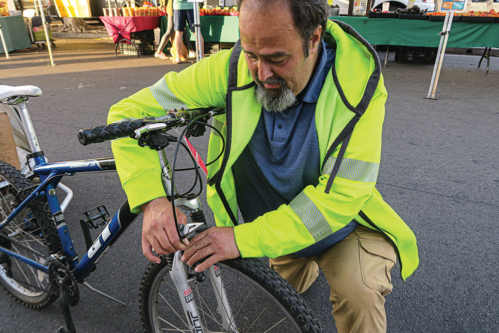 Marcos is making a simple bicycle repair. 