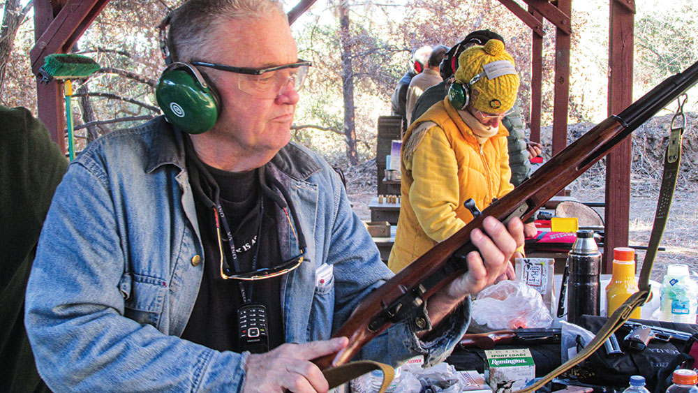 Mel Haffenfeld practices at the range with some long guns.