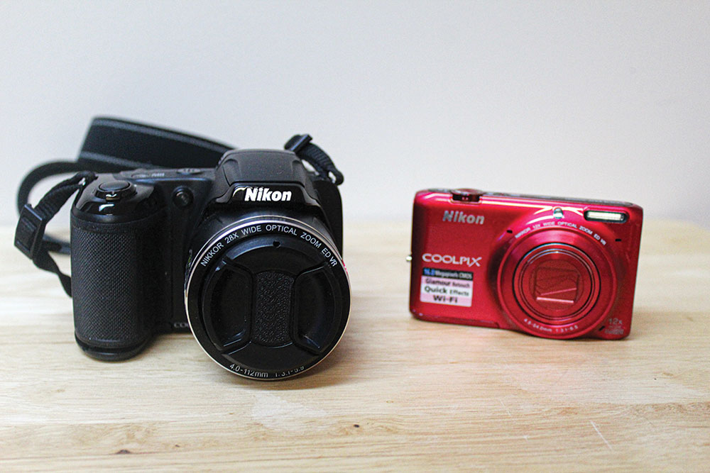 Two examples of small, simple point-and-shoot digital cameras.