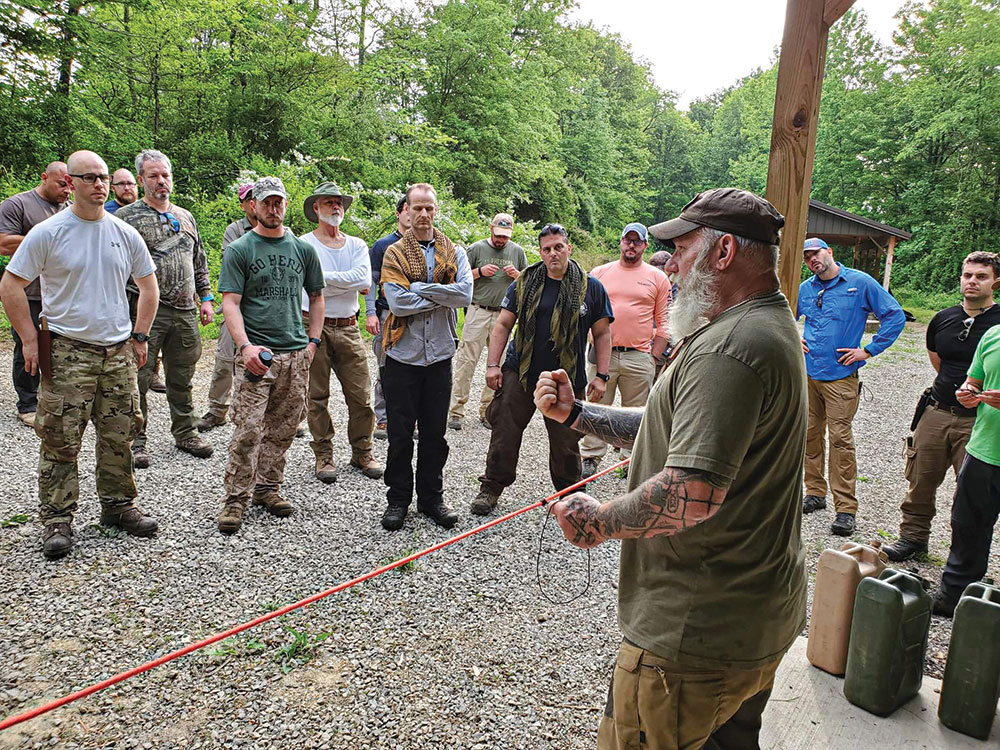 Canterbury demonstrates setting up a ridgeline for a tarp