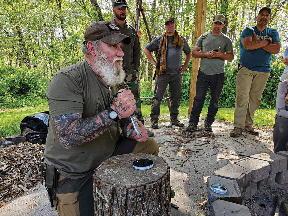 Flint strikes on the spine of a Mora Garberg knife with a 90-degree spine