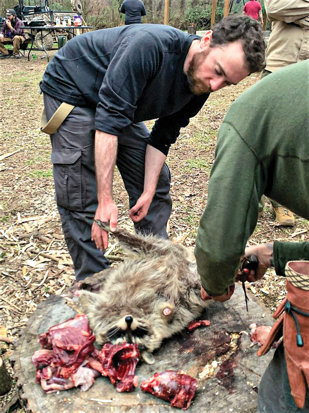 Students clean a raccoon
