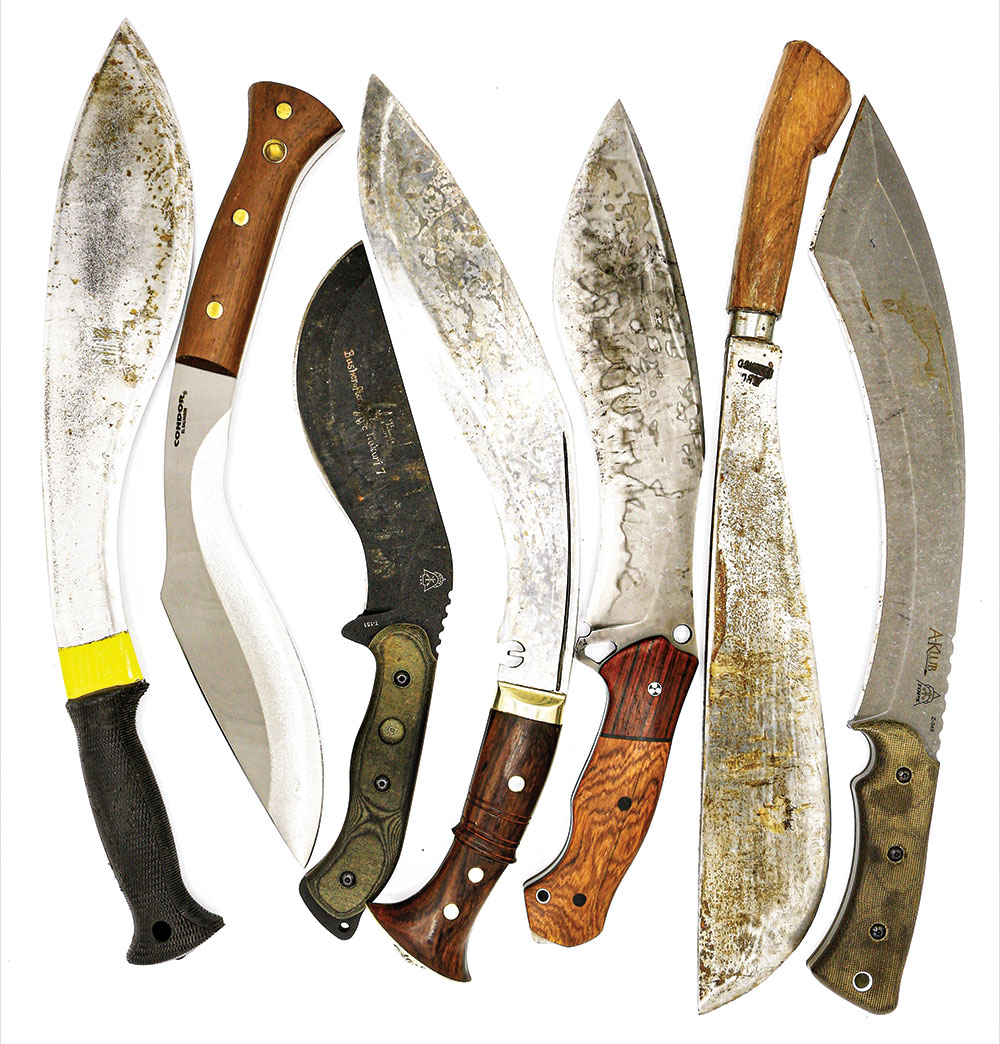 Knives By Hand 12-inch Survival Kukri (middle), surrounded by various kukri-styled knives.