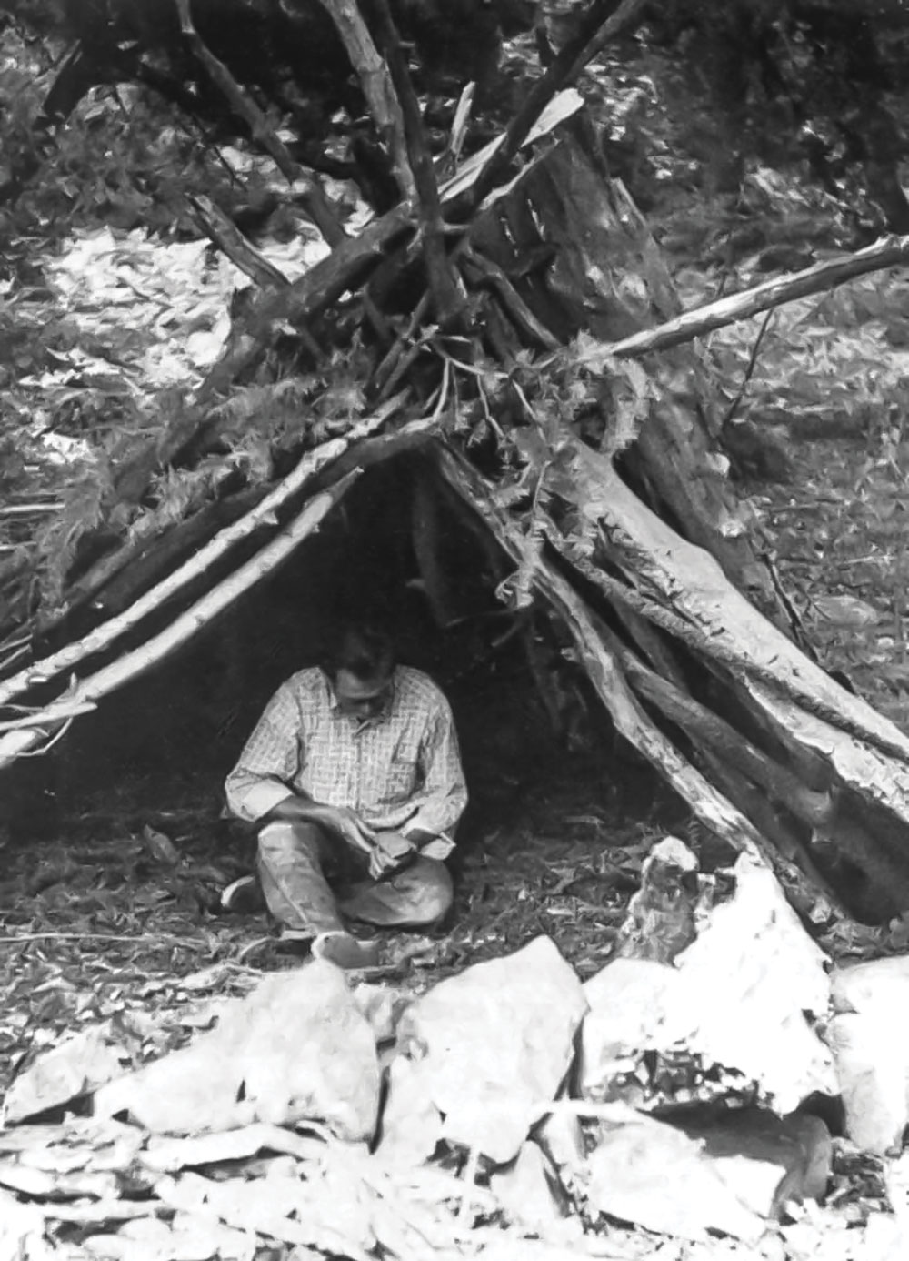 Olsen works on primitive skills in one of his wickiups, circa late 1960s. (Photo: Olsen archives)