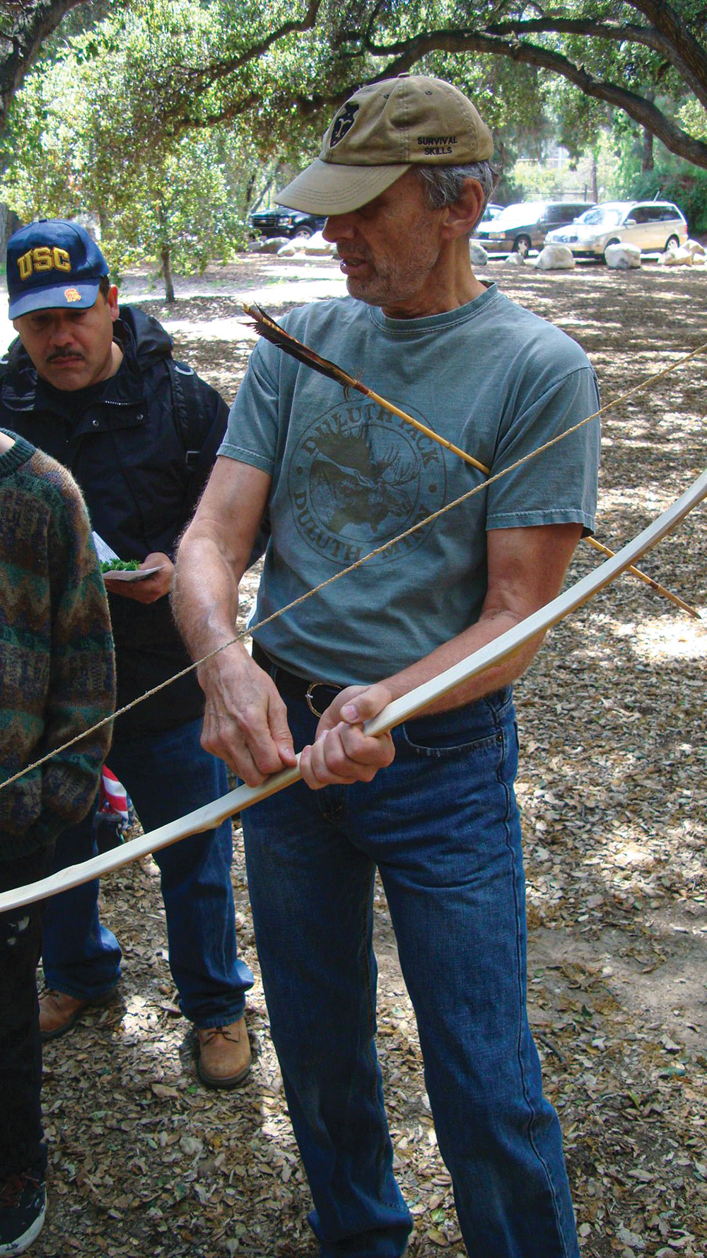 At a workshop given by the School of Self-Reliance, author and anthropologist Paul Campbell shows a bow he made from entirely primitive techniques after the style of Larry Dean Olsen. 
