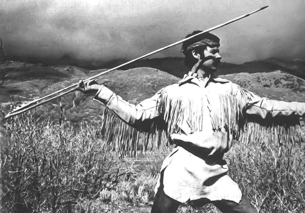 Dave Wescott hurls a spear with an atlatl during a field trip with Olsen, circa 1973.