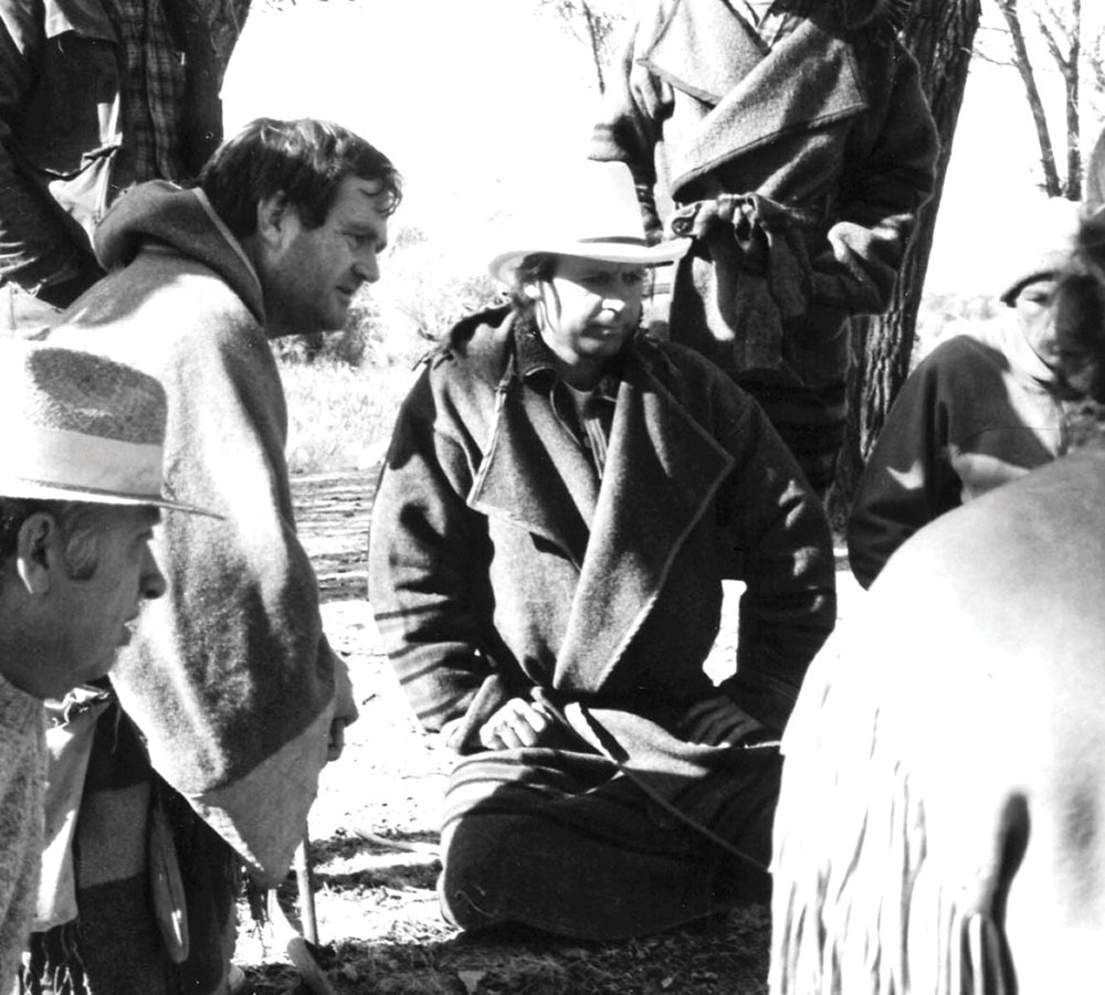 Olsen (leaning) and Dave Wescott (center, with white hat) at the 1988 Rabbit Stick Rendezvous (Photo: Larry Wells)