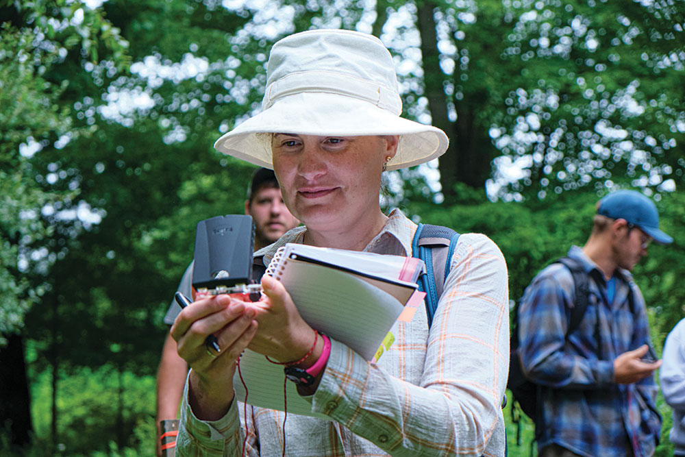 A student takes her first bearing in the field