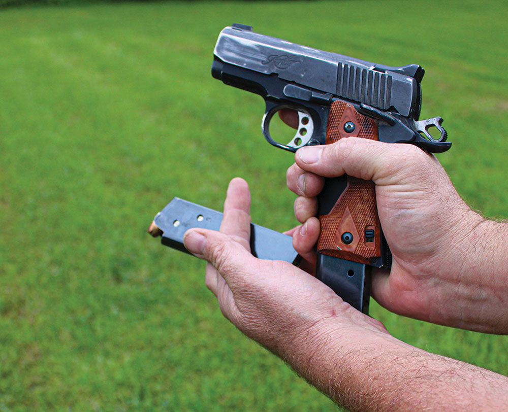 In a tactical reload, you need to catch the magazine from the gun by slipping the full magazine between the middle and ring fingers.