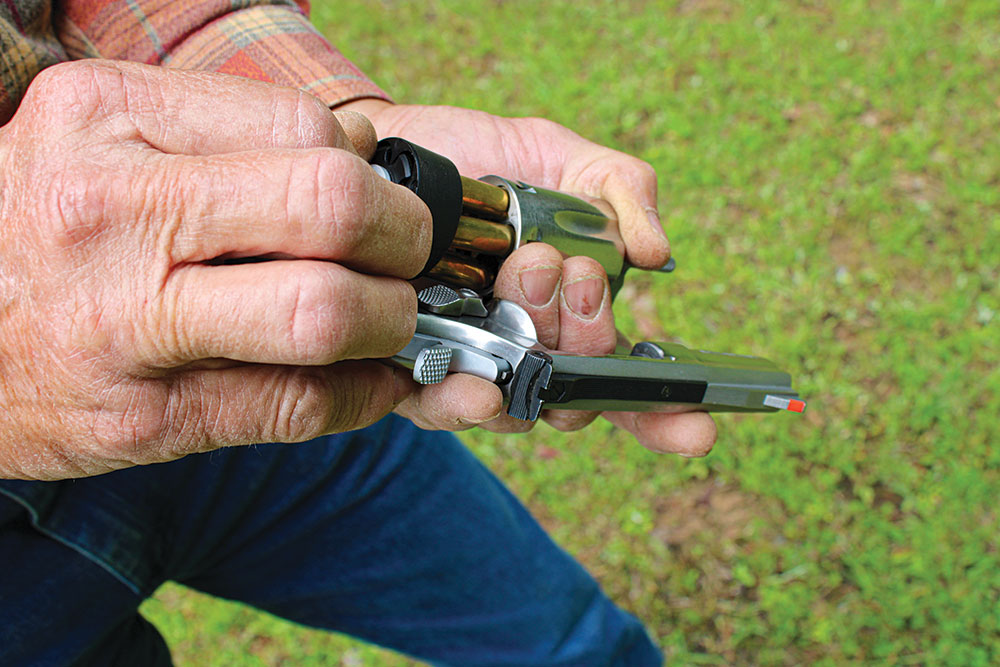 Once the cylinder is empty, use the speed loader to insert fresh rounds and let the reloader drop.