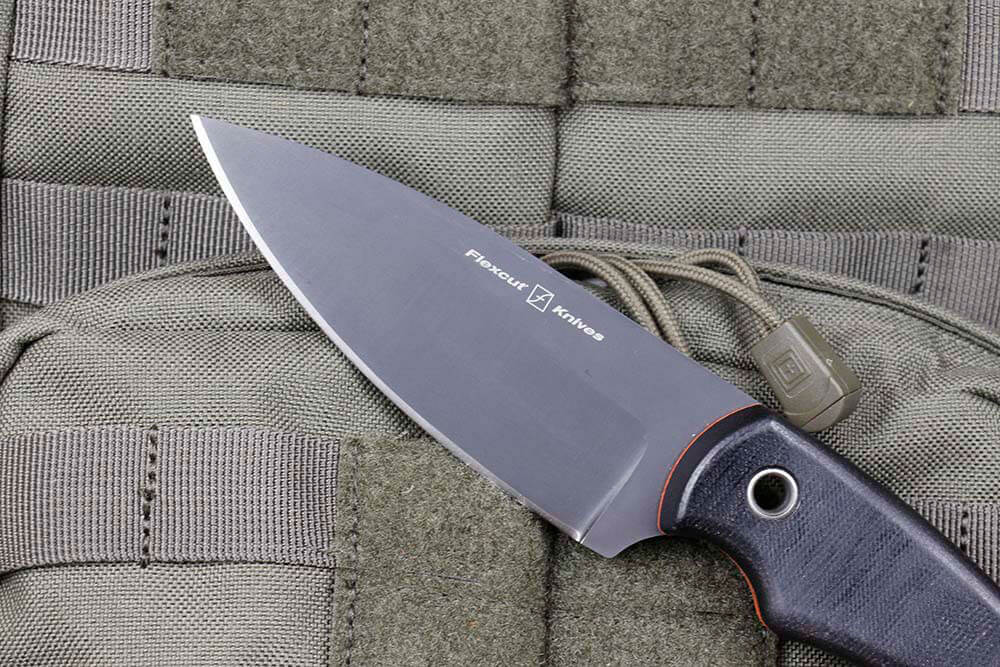 The Nomad features a four-inch drop-point blade of 1095 steel with a high, flat grind.