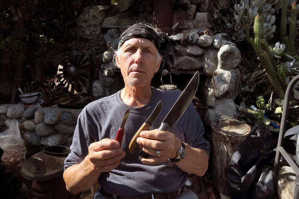 Nyerges with his three preferred survival knives, one from each category