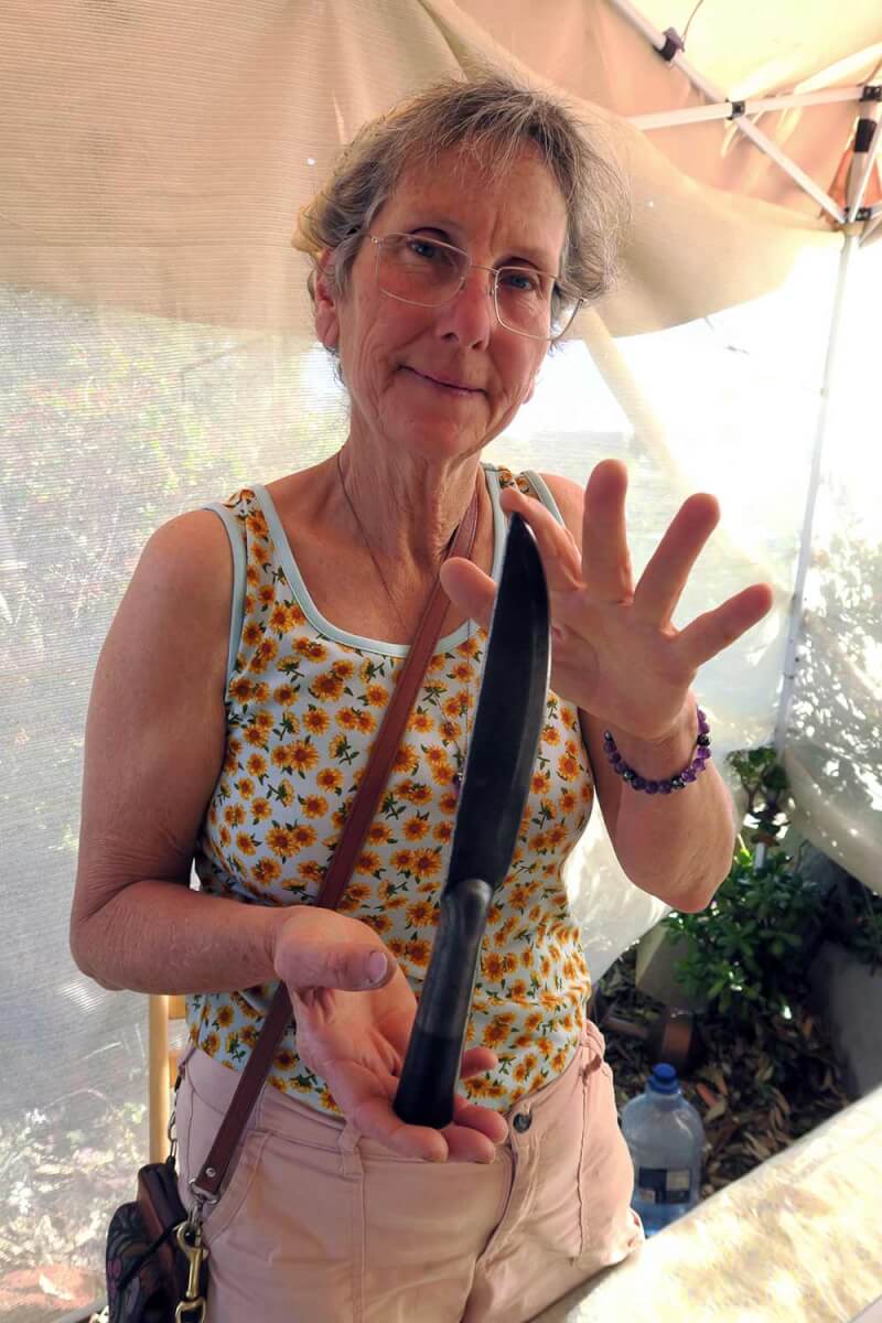 Urban homesteader and farmer Julie Balaa shows Nyerges’ big knife, the Cold Steel Bushman.