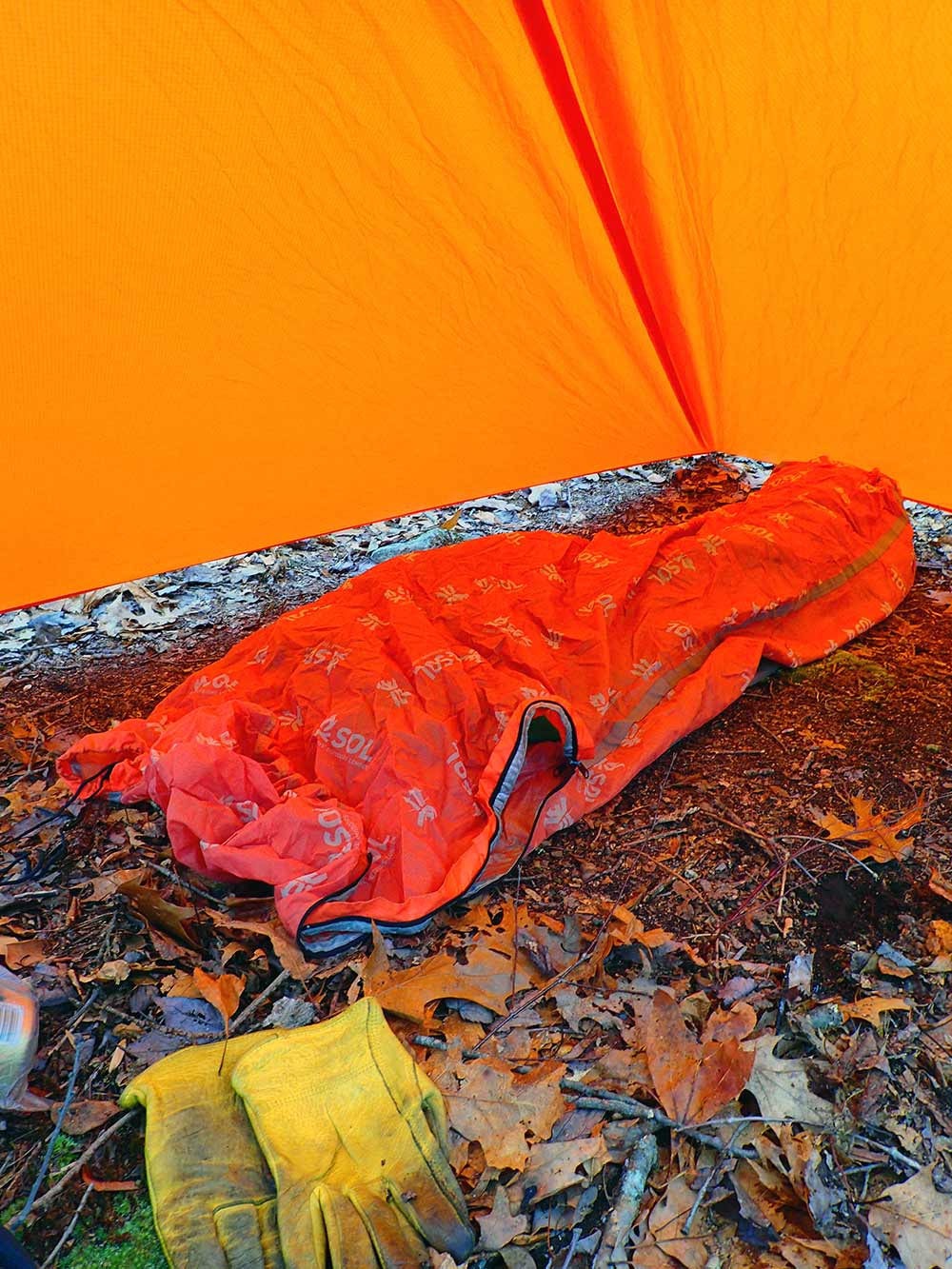 SOL Escape Bivy Pro adds 10-degrees of warmth and protects the quilt and anything put inside while camp is set up.