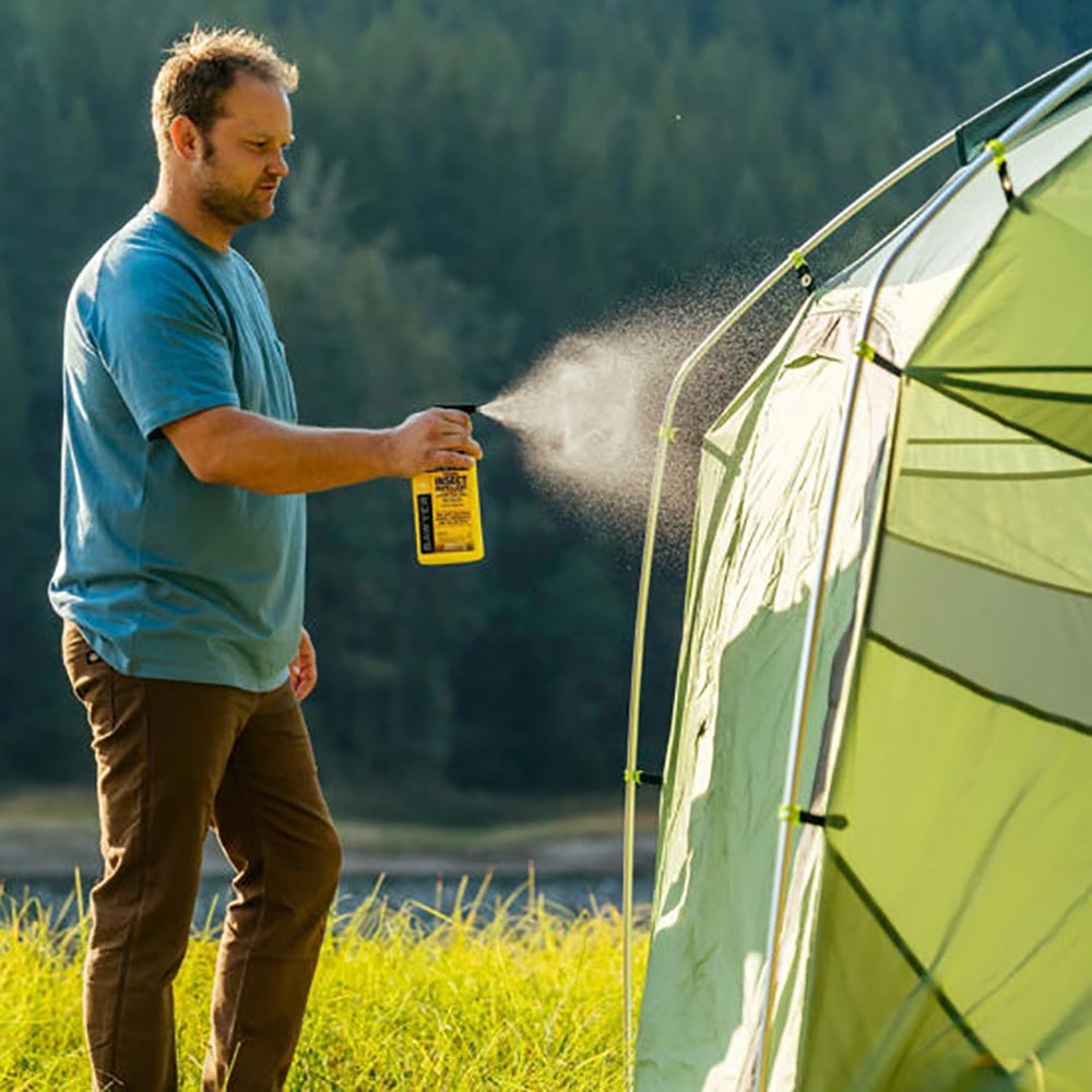 spraying your camping gear with permethrin