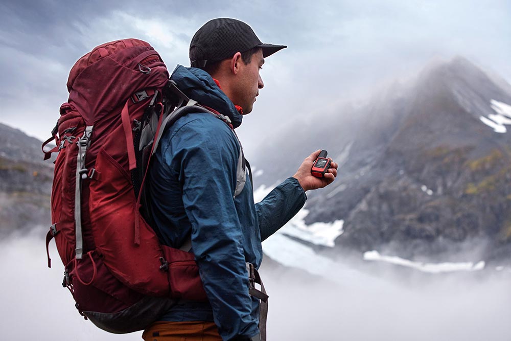 Hiker with a Garmin product 